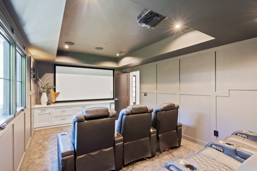 Inspiration for a transitional enclosed carpeted and beige floor home theater remodel in San Francisco with gray walls and a projector screen