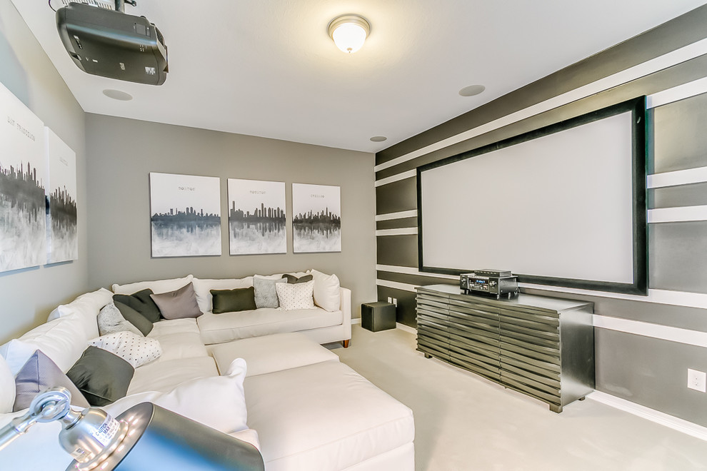 Bild på ett avskild hemmabio, med grå väggar, heltäckningsmatta och vitt golv