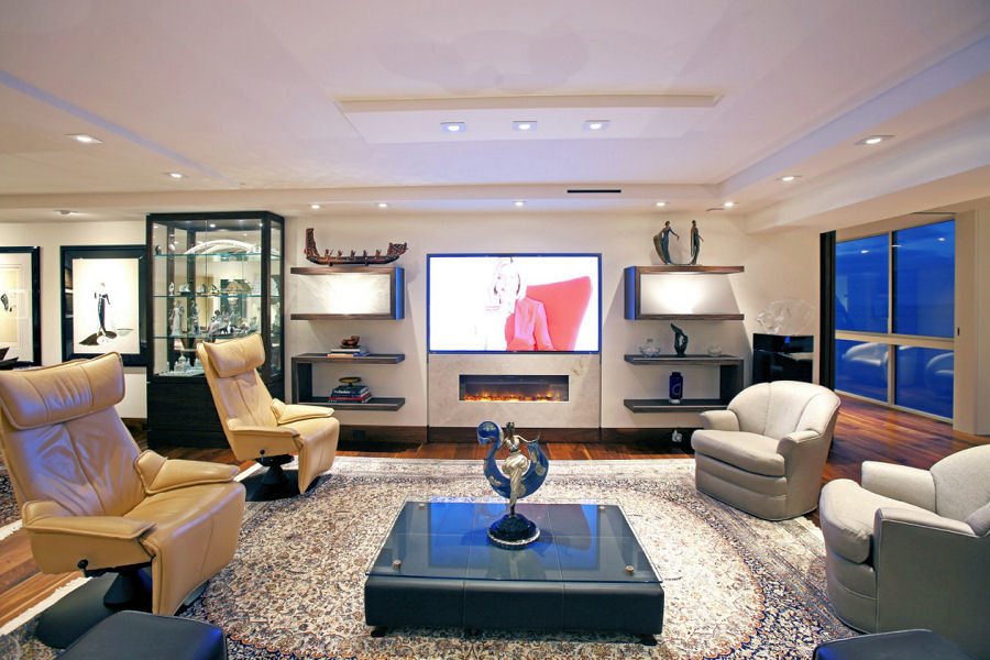 Example of a mid-sized minimalist open concept dark wood floor home theater design in San Diego with white walls and a wall-mounted tv