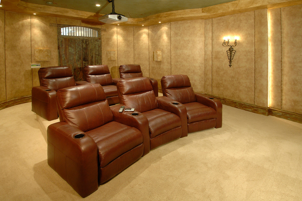 Medium sized victorian enclosed home cinema in Austin with beige walls, carpet and a projector screen.