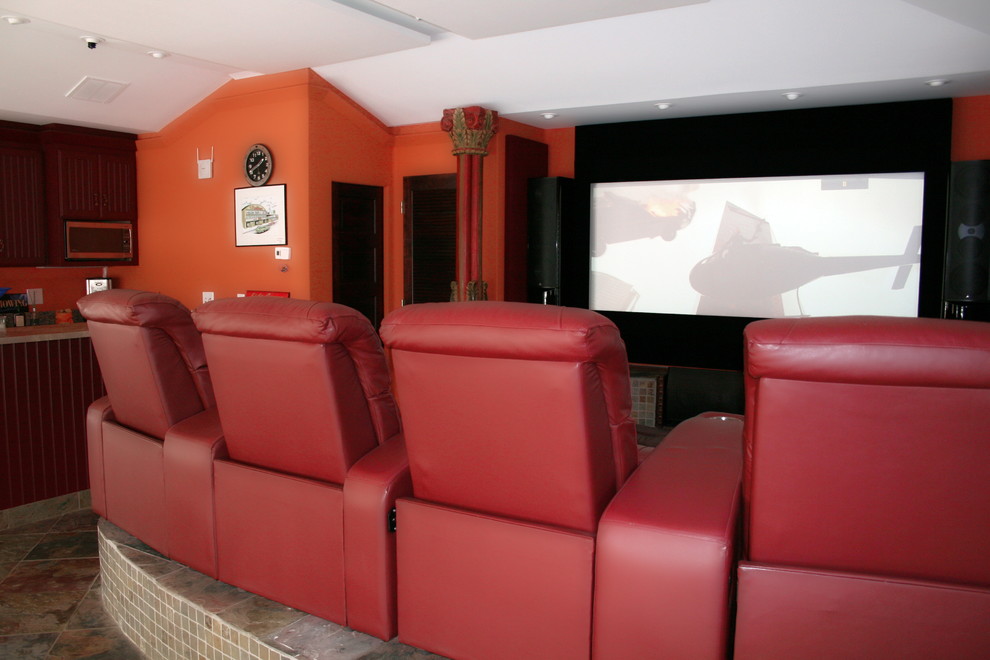 Traditional enclosed home cinema in Other with orange walls, terracotta flooring, a projector screen and multi-coloured floors.
