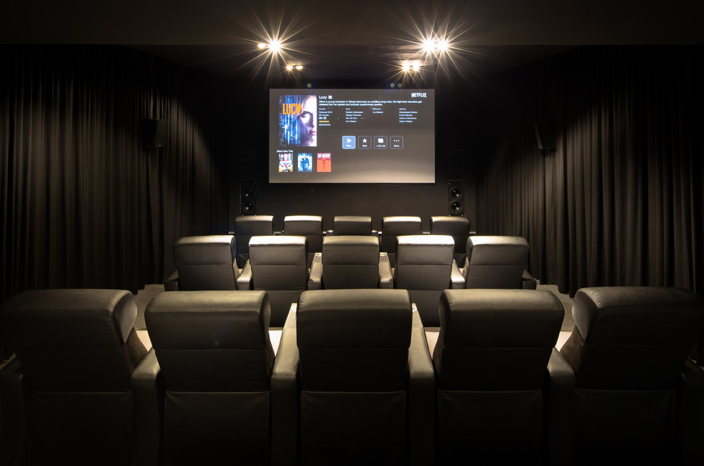 Inspiration for a contemporary carpeted and gray floor home theater remodel in Other with black walls and a projector screen