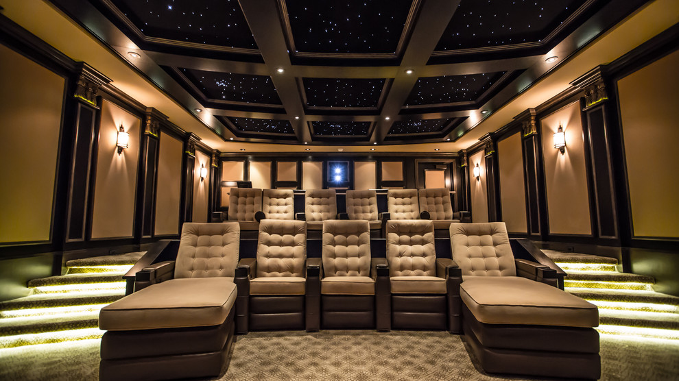 Photo of a medium sized traditional enclosed home cinema in Edmonton with beige walls, carpet and a projector screen.