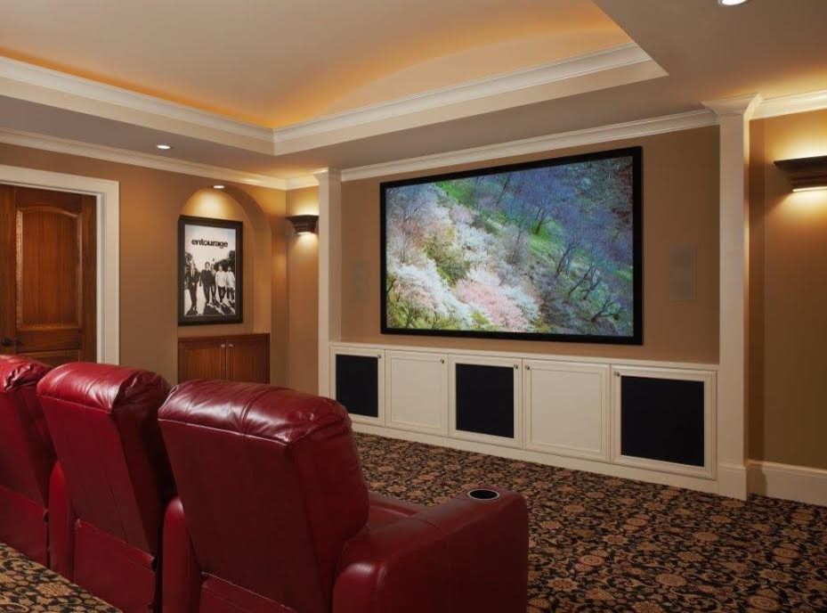 Inspiration for a mid-sized timeless enclosed carpeted home theater remodel in Detroit with beige walls and a projector screen