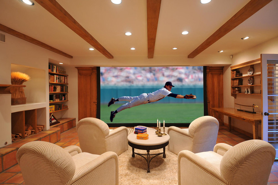 Design ideas for a mediterranean home cinema in Los Angeles with a projector screen.