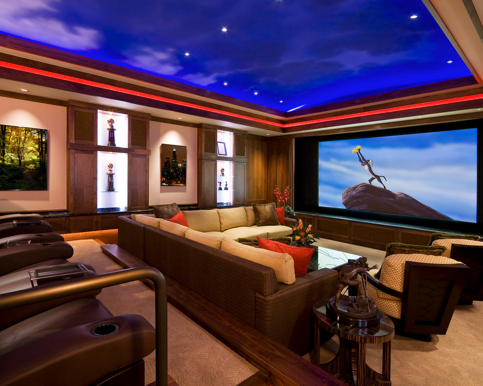 Home theater - traditional enclosed home theater idea in Los Angeles with a projector screen