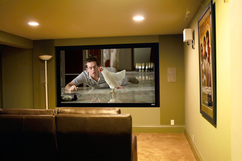 Design ideas for a traditional enclosed home cinema in San Francisco with yellow walls, carpet and a wall mounted tv.