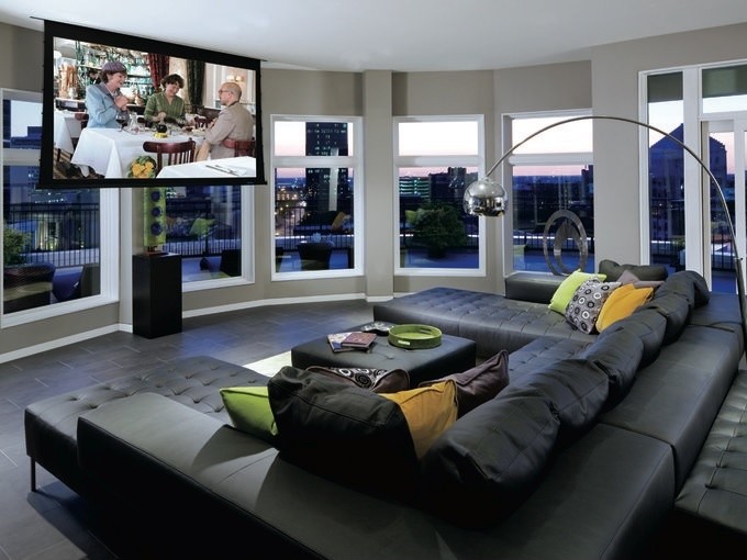 Photo of a medium sized contemporary open plan home cinema in Indianapolis with grey walls, ceramic flooring and a projector screen.
