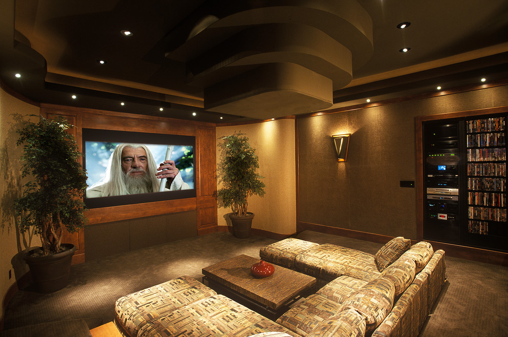 Design ideas for a large contemporary enclosed home cinema in Austin with brown walls, carpet and a projector screen.