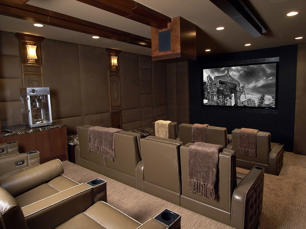 Mid-sized elegant carpeted home theater photo in Las Vegas with brown walls and a projector screen