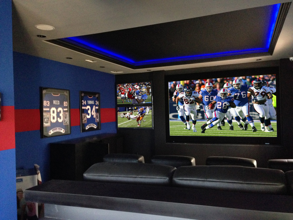 Design ideas for a large contemporary enclosed home cinema in New Orleans with a wall mounted tv and blue walls.