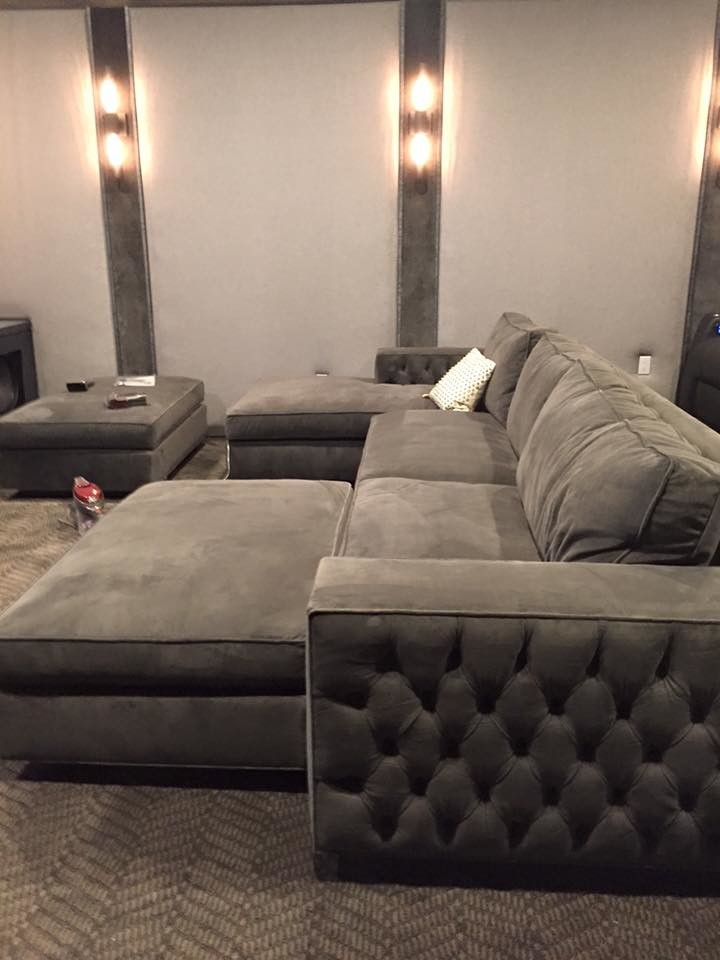 Large trendy enclosed carpeted home theater photo in Los Angeles with gray walls