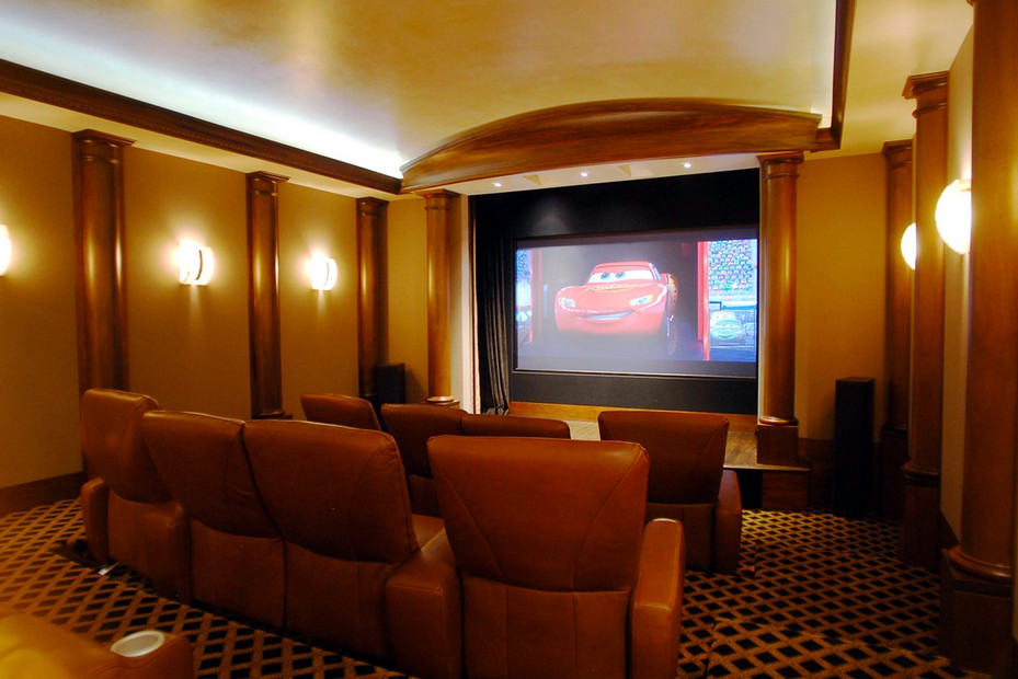 Transitional open concept home theater photo in Other with beige walls and a projector screen