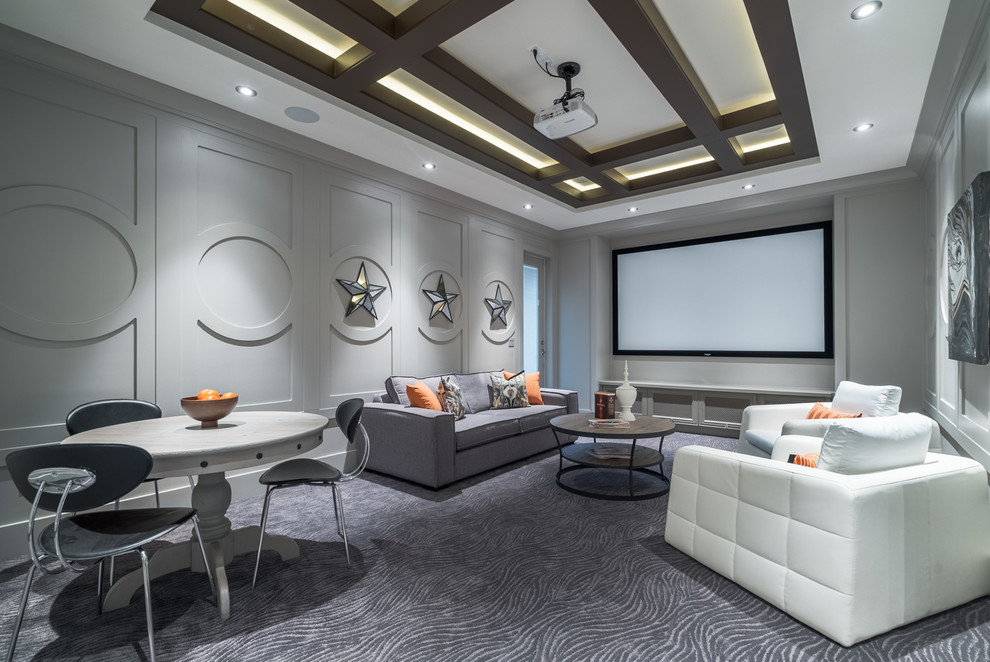 Example of a large trendy enclosed carpeted and gray floor home theater design in Vancouver with gray walls and a projector screen