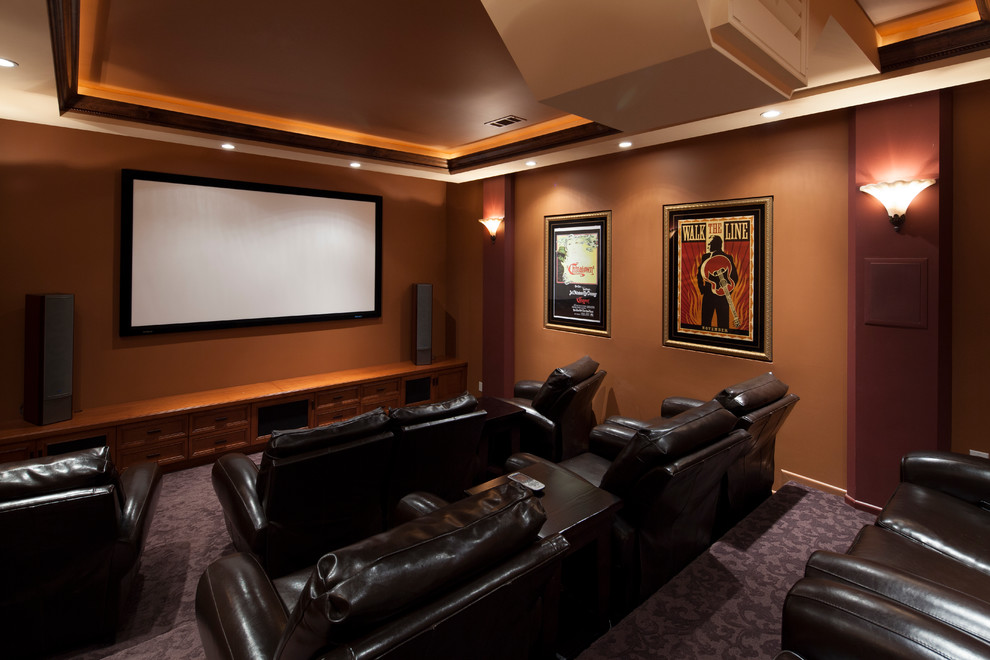 Inspiration for a mid-sized timeless enclosed carpeted home theater remodel in Los Angeles with a projector screen