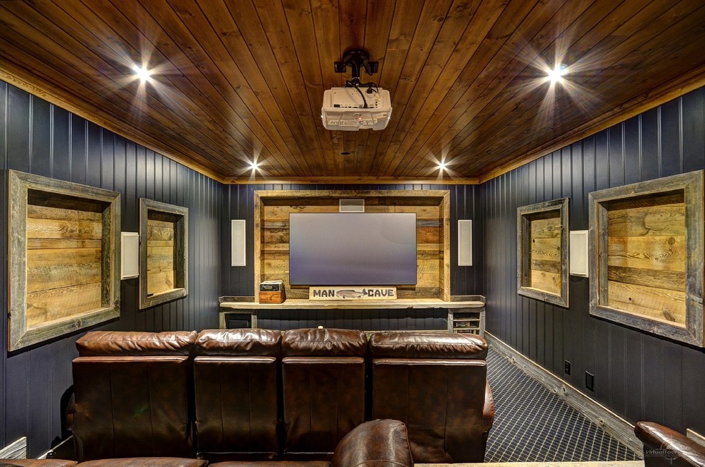 Design ideas for a rustic enclosed home cinema in Toronto with black walls, carpet and a projector screen.