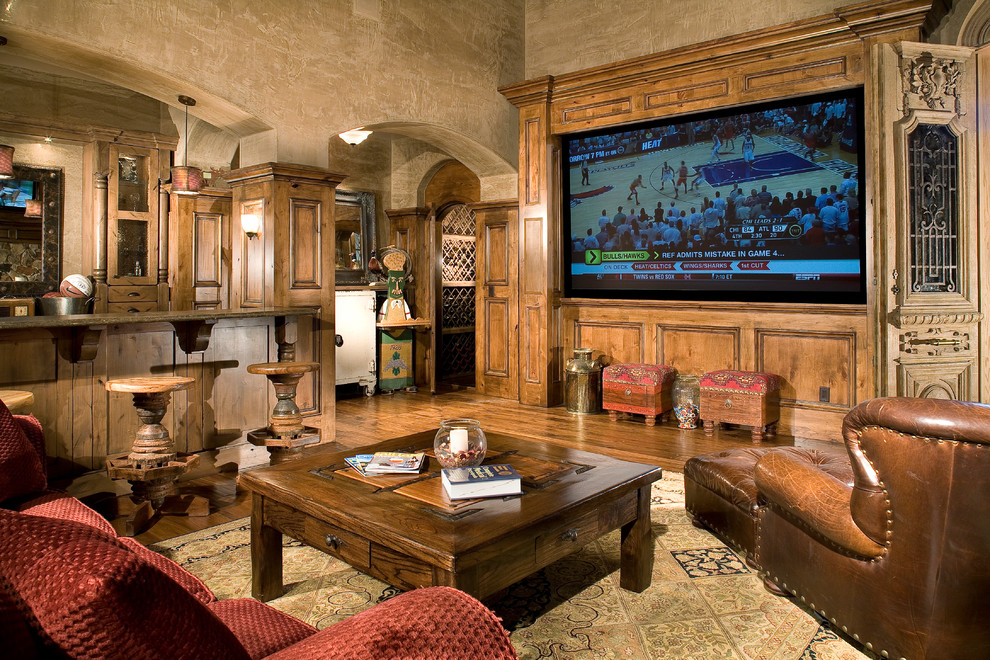 Example of a huge classic enclosed dark wood floor home theater design in Salt Lake City with beige walls and a media wall