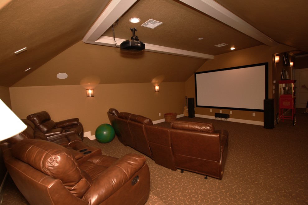 Inspiration for a large timeless enclosed carpeted home theater remodel in Houston with beige walls and a projector screen
