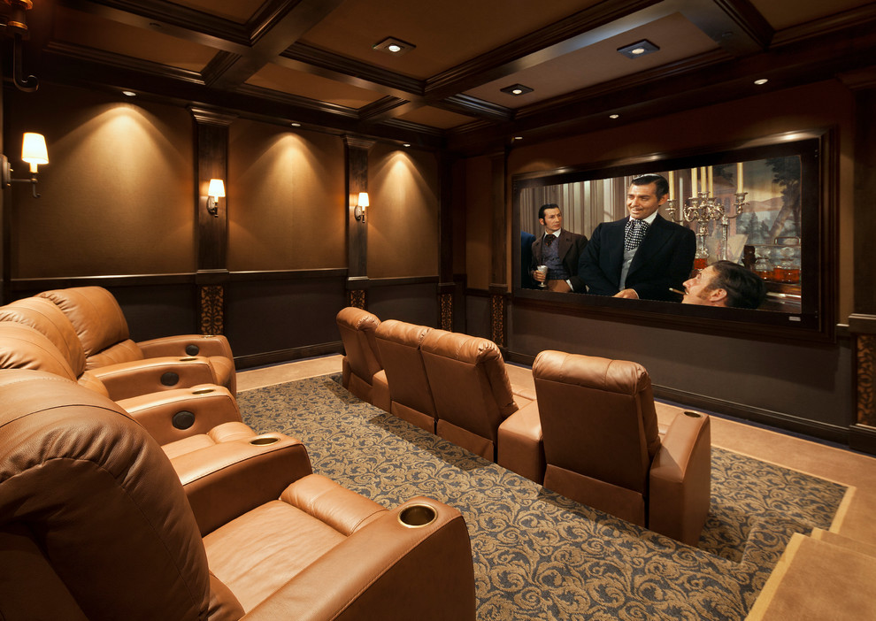 This is an example of a large classic enclosed home cinema in Santa Barbara with a projector screen.