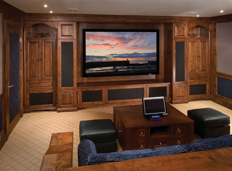 Large elegant enclosed carpeted home theater photo in Vancouver with a media wall and blue walls