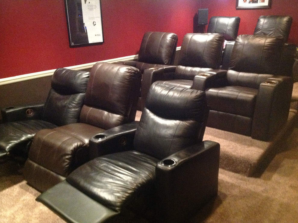 Mid-sized enclosed carpeted and beige floor home theater photo in Detroit with red walls and a media wall