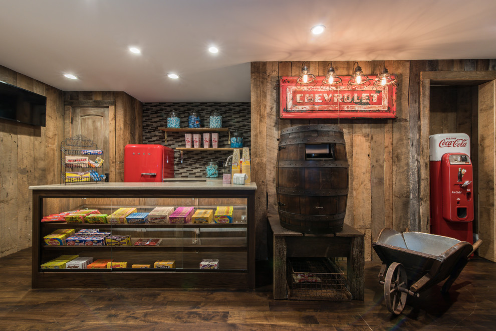 Photo of a rustic enclosed home cinema in Charlotte with brown walls, dark hardwood flooring and a wall mounted tv.