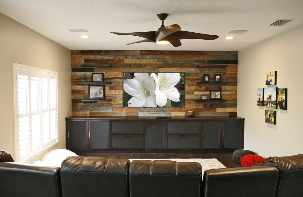 Inspiration for a large contemporary open concept dark wood floor and brown floor home theater remodel in Tampa with beige walls and a wall-mounted tv