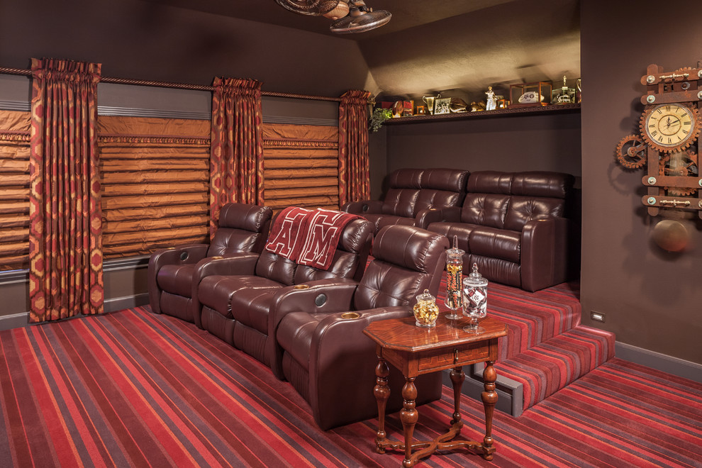 Home theater - large traditional enclosed carpeted and multicolored floor home theater idea in Other with red walls and a media wall