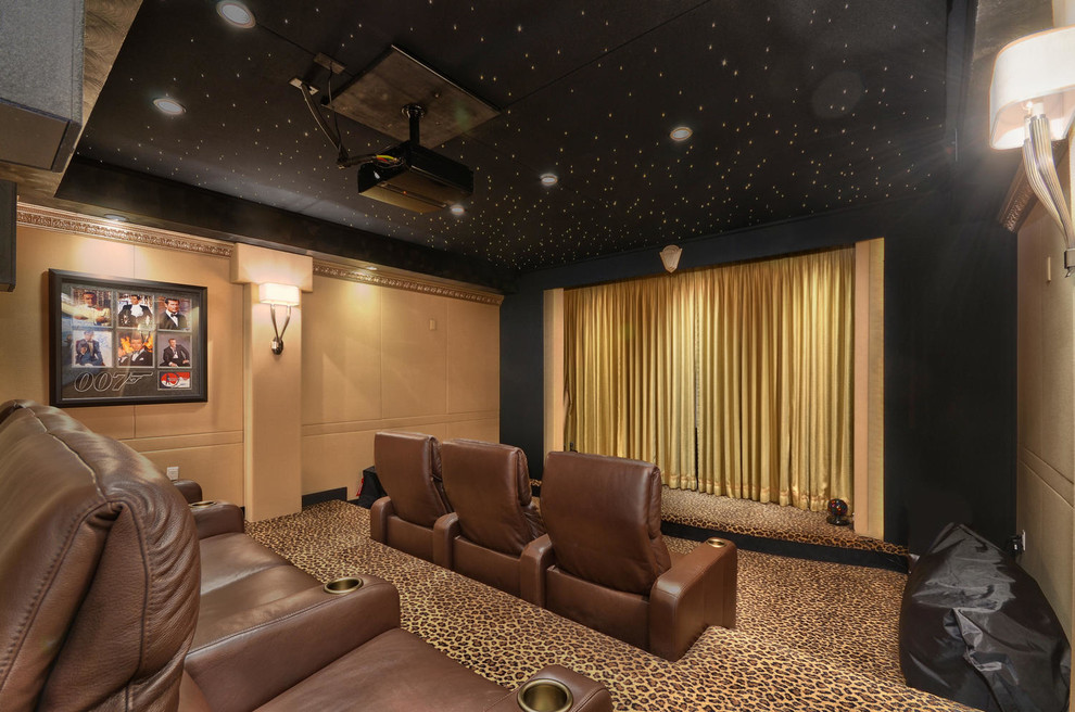 Inspiration for a large transitional enclosed carpeted home theater remodel in Tampa with beige walls and a projector screen