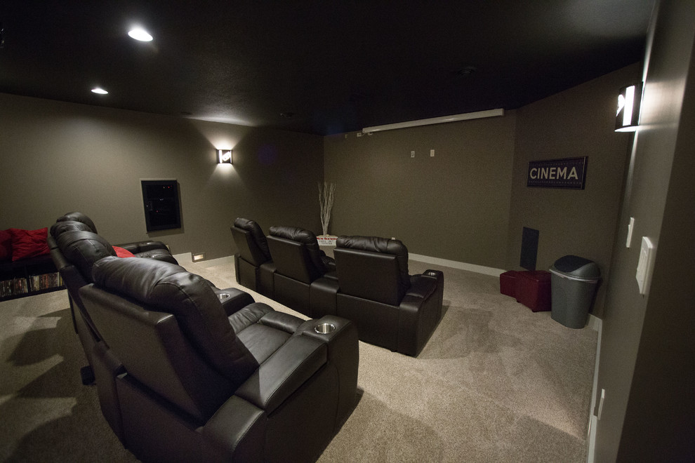 Example of an arts and crafts carpeted home theater design in Other with a projector screen