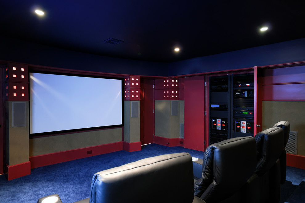Home theater - mid-sized craftsman enclosed carpeted and blue floor home theater idea in New York with green walls and a projector screen