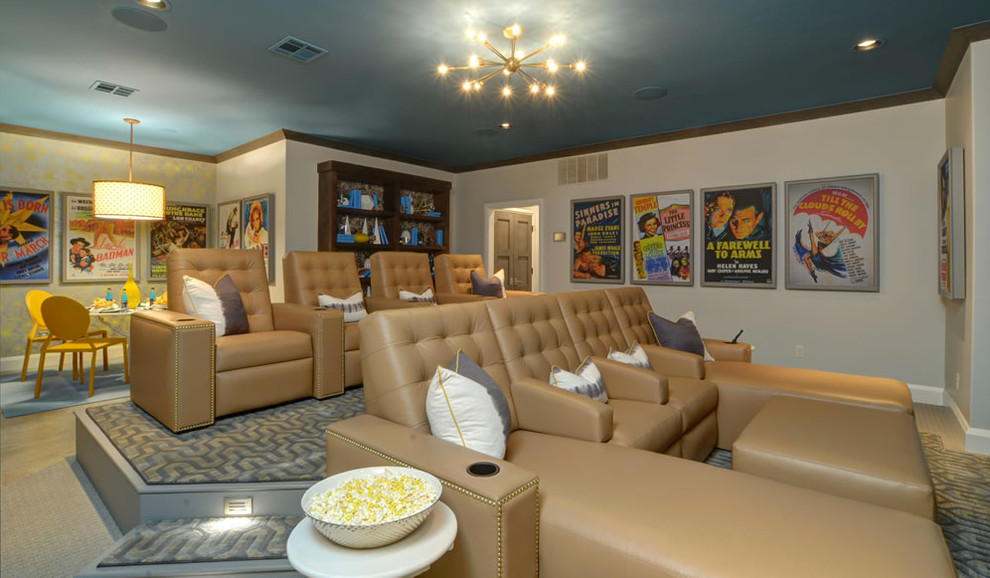 Home theater - large contemporary open concept carpeted home theater idea in Oklahoma City with beige walls and a wall-mounted tv