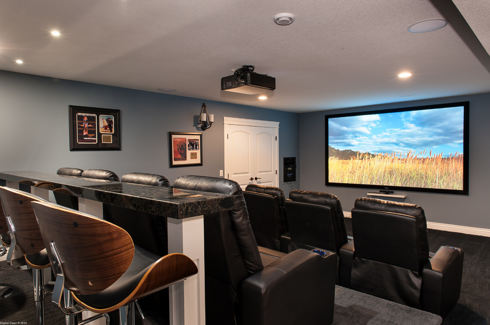 Inspiration for a large transitional enclosed carpeted and gray floor home theater remodel in Vancouver with blue walls and a projector screen