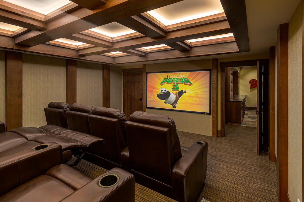 Inspiration for a large classic enclosed home cinema in Calgary with carpet, a projector screen and grey walls.