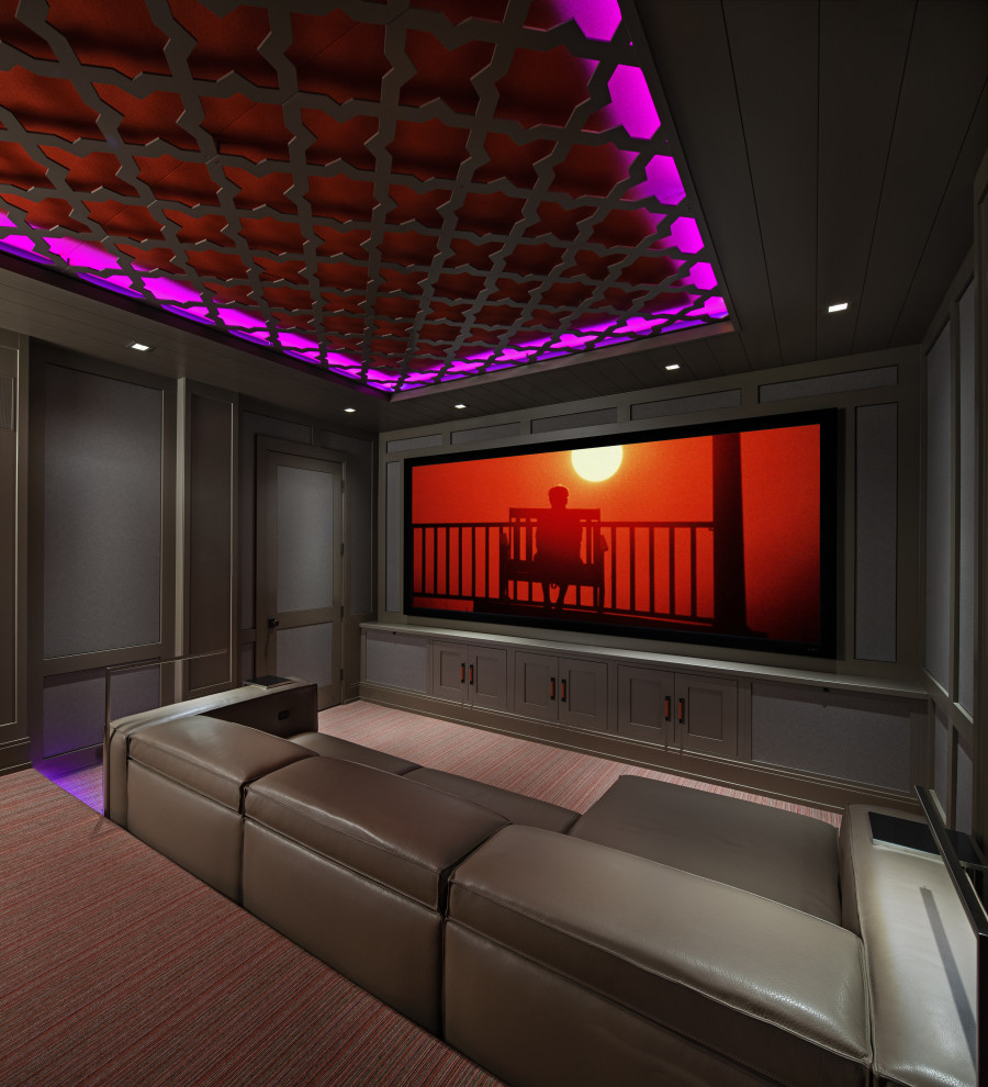 На фото: домашний кинотеатр с серыми стенами, ковровым покрытием, проектором и разноцветным полом с