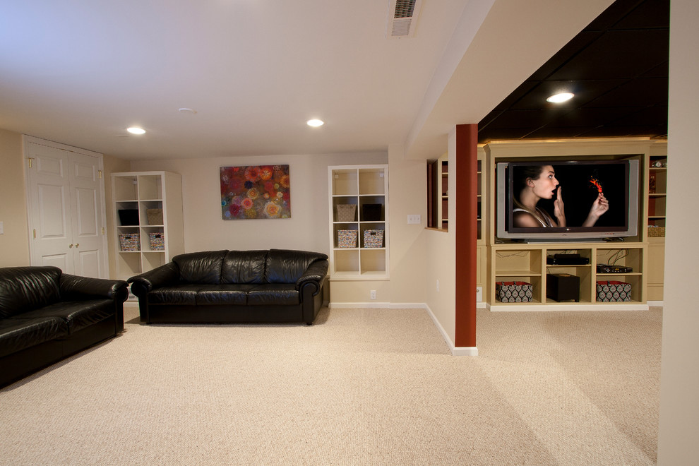 Home theater - large traditional open concept carpeted home theater idea in Newark with red walls and a media wall