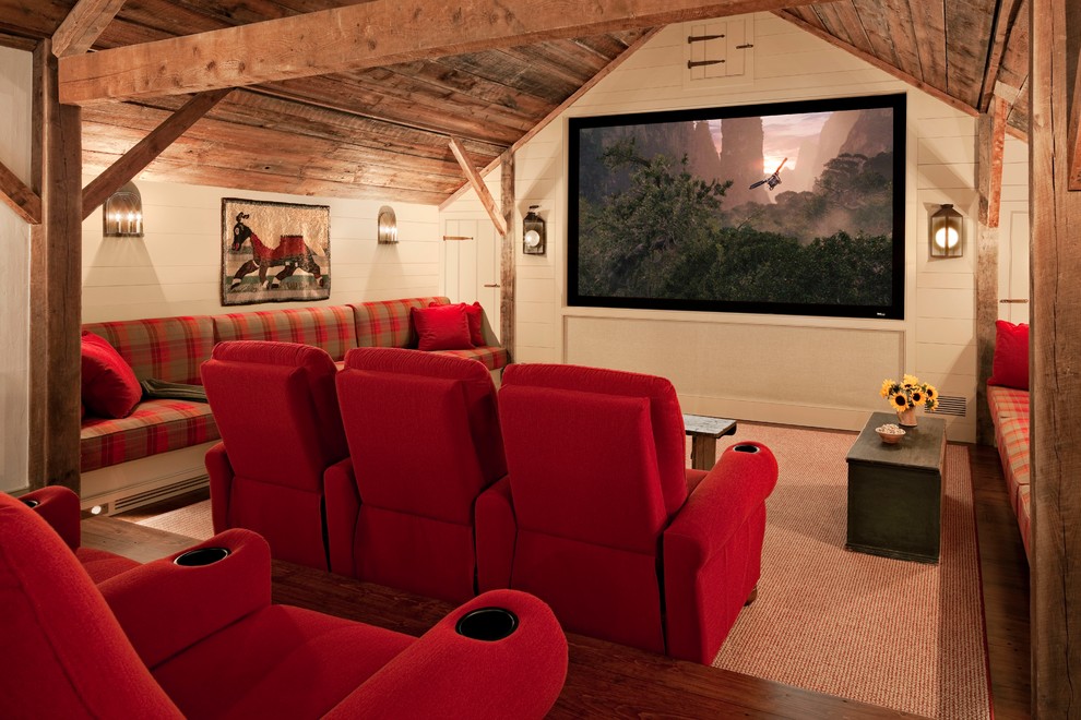 На фото: домашний кинотеатр в стиле кантри с серыми стенами, паркетным полом среднего тона и проектором с