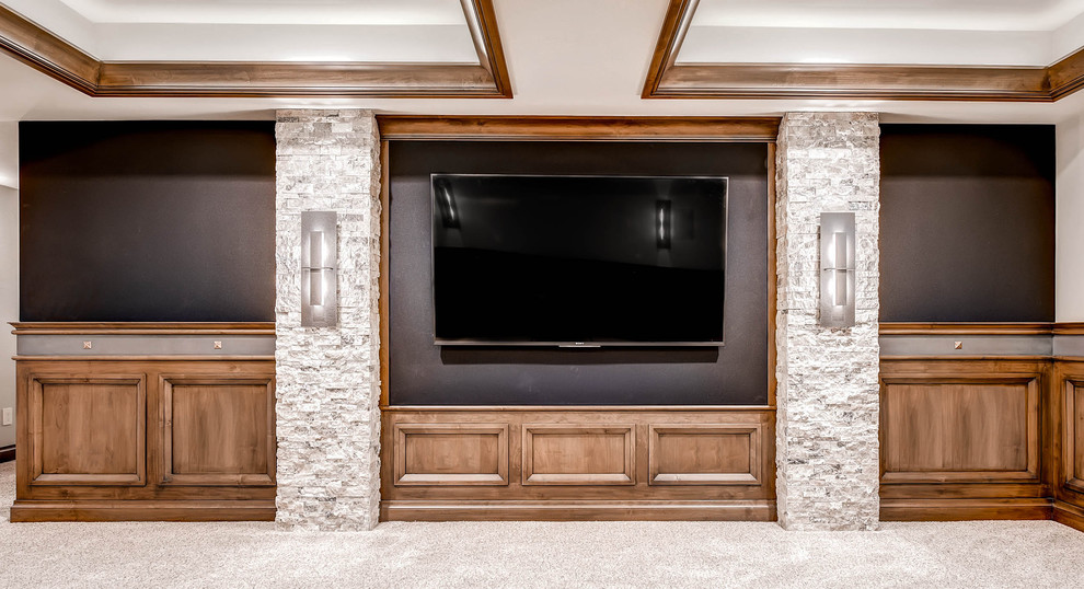 Large transitional enclosed carpeted home theater photo in Denver with beige walls and a media wall