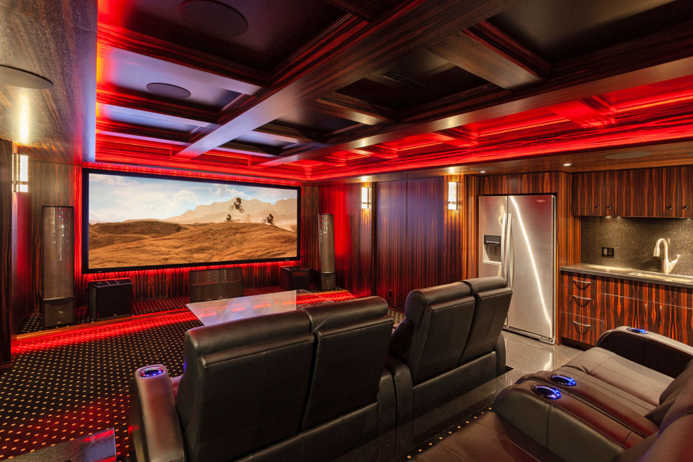 This is an example of a large enclosed home cinema in Calgary with brown walls, carpet, a projector screen and black floors.