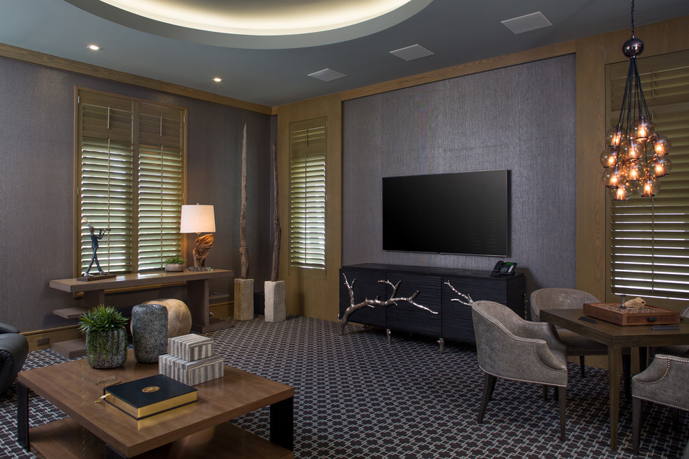 Inspiration for a huge transitional enclosed carpeted home theater remodel in Orlando with gray walls and a wall-mounted tv