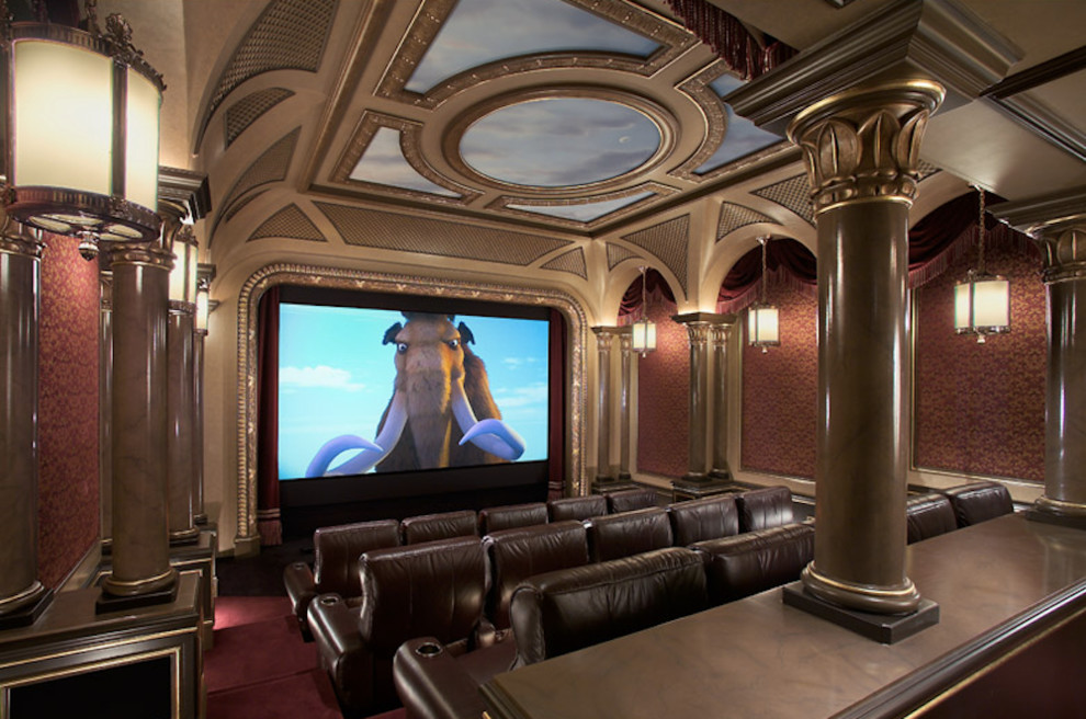 На фото: большой изолированный домашний кинотеатр в стиле модернизм с красными стенами, ковровым покрытием, проектором и красным полом