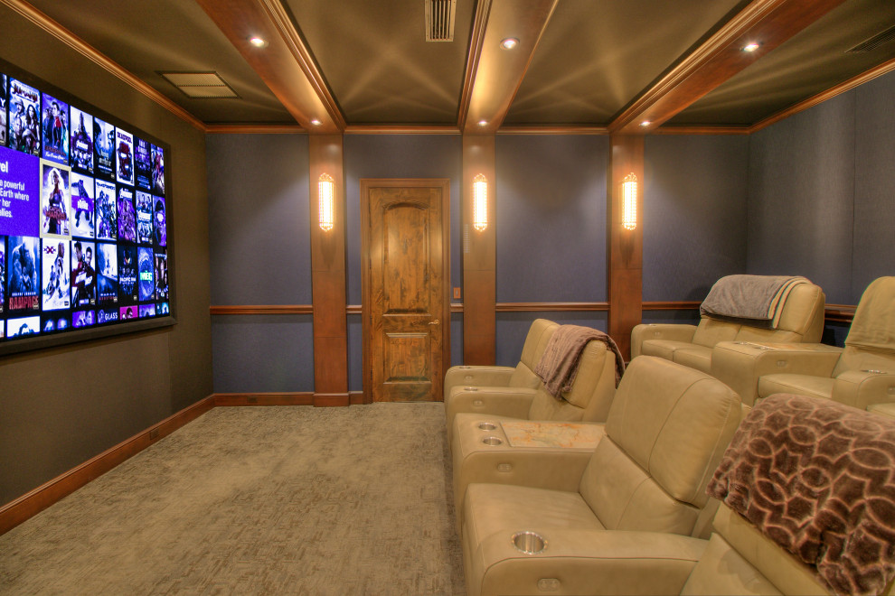 Medium sized mediterranean enclosed home cinema in Miami with blue walls, carpet, a projector screen and multi-coloured floors.