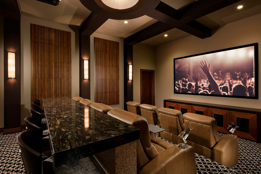 Photo of a home cinema in Las Vegas with beige walls, carpet and black floors.