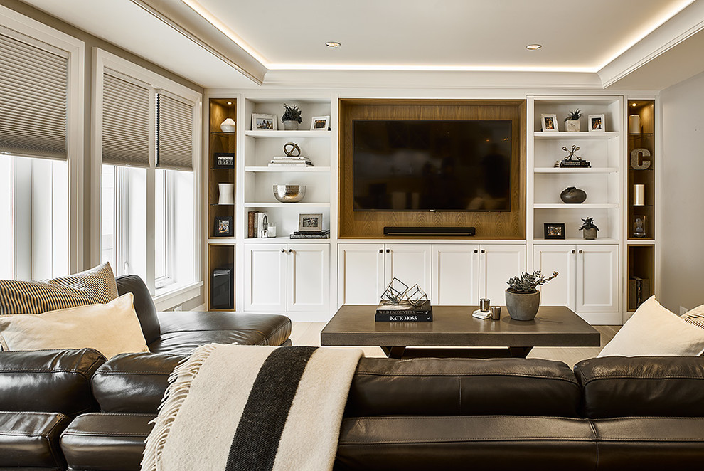 Inspiration for a medium sized classic enclosed home cinema in Vancouver with white walls, light hardwood flooring, a built-in media unit and brown floors.