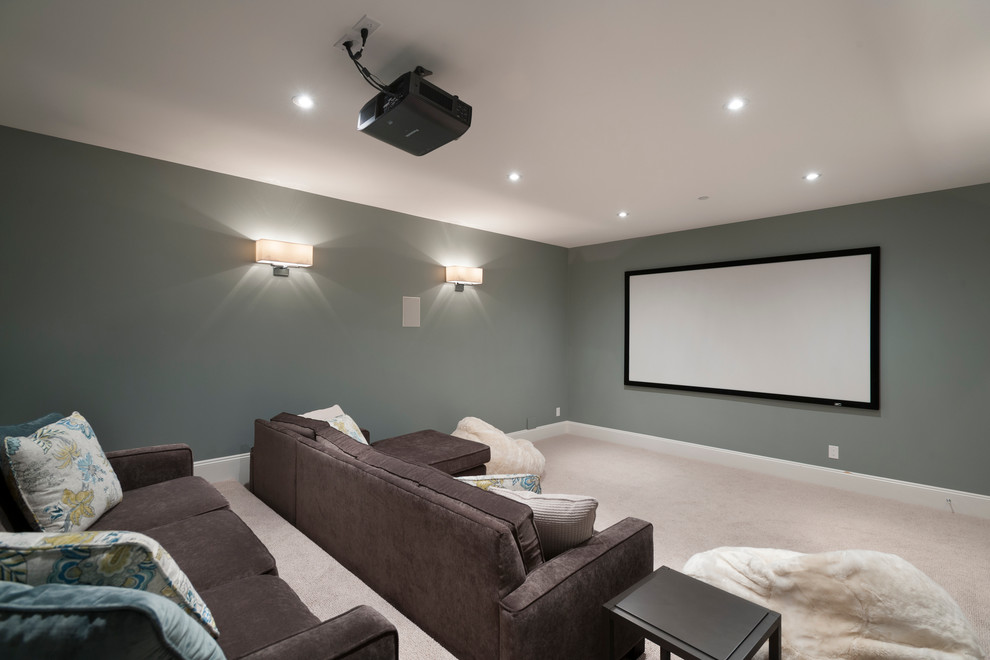 Example of a large transitional enclosed carpeted home theater design in Vancouver with gray walls and a projector screen