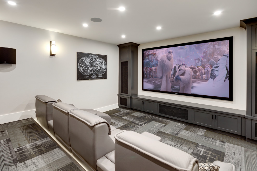 Example of a large transitional enclosed carpeted and gray floor home theater design in Calgary with gray walls and a projector screen