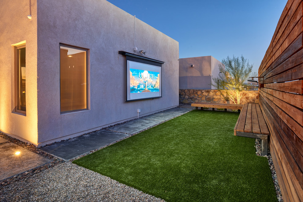 Home theater - small contemporary open concept concrete floor and green floor home theater idea in Austin with white walls and a projector screen