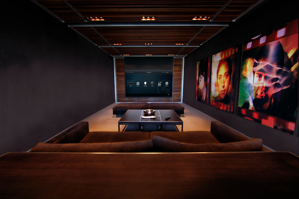 Contemporary home cinema in Boston with black walls, beige floors and a feature wall.