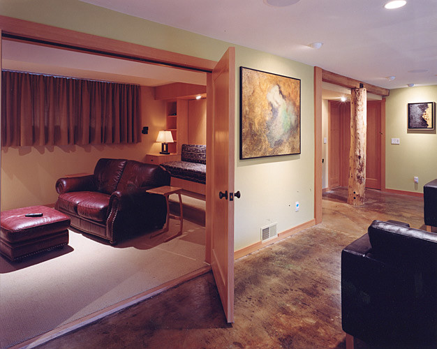 Example of a mid-sized transitional enclosed carpeted home theater design in Seattle with beige walls and a media wall