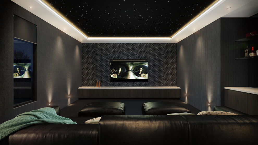 Immagine di un grande home theatre minimalista chiuso con pareti grigie, moquette e TV a parete